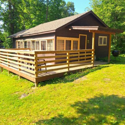 Exterior and deck of Sunshine Cabin #8 at Crow Wing Crest Lodge in Akeley, MN, on 11th Crow Wing Lake in Hubbard County